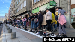 Sarajevans march in a silent tribute in April 2024 alongside shoes marking the victims of the three-year siege of Sarajevo from 1992 to 1996, a tragedy from which Sila's family fled.
