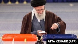 Iran's Supreme Leader Ayatollah Ali Khamenei casts his ballots at a polling station in Tehran on March 1.