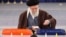 Iran's Supreme Leader Ayatollah Ali Khamenei casts his ballots at a polling station in Tehran on March 1.