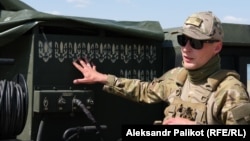 Oleksandr points to 12 Ukrainian coats of arms on his Stinger missile system, representing Russian targets he shot down.