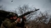 A Ukrainian soldier from the 93rd Mechanized Brigade fires an AK-74 assault rifle at Russian positions near Bakhmut on March 6.<br />
<br />
Despite artillery and equipment shortages, Kyiv&#39;s troops are fighting to slow advancing Russian troops along the almost 1,200-kilometer front.<br />
&nbsp;