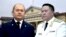 Жаңы дайындалган башкы прокурор Максат Асаналиев жана мурдагы прокуров Курманкул Зулушев. (коллаж)
