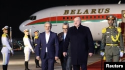 The U.S. Treasury Department has blocked a Boeing 737 that it says has been used by Belarus's authoritarian leader Alyaksandr Lukashenka (second from right) and his family for official business and personal trips.