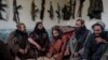 -- Taliban fighters enjoy lunch inside an adobe house that is used as a makeshift checkpoint in Wardak province, Afghanistan, Thursday June 22, 2023.Daily Life
