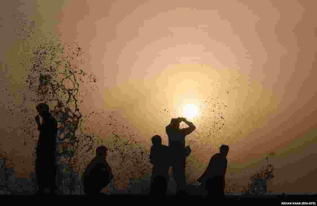 People visit the beach despite warnings about the approaching Cyclone Biparjoy, in Karachi, Pakistan.