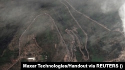 A satellite image shows a long traffic jam of vehicles along the Lachin corridor as ethnic Armenians flee from Nagorno-Karabakh , September 26, 2023.