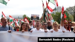 Peter Magyar (center) leads an anti-government protest in Budapest on April 6.