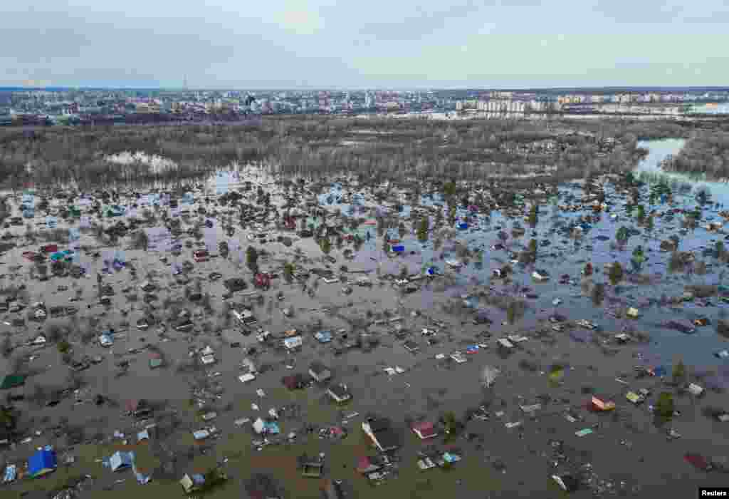 A drone view shows a flooded residential area in the settlement of Zarechnoye, Orenburg region, Russia. Swollen rivers around the border areas between Russia and Kazakhstan have wreaked havoc over the past week, pushing tens of thousands of people out of their homes.