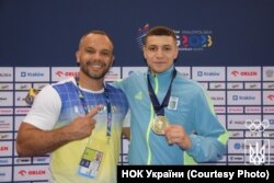 Андрій Заплітний із тренером Олександром Пікуліним