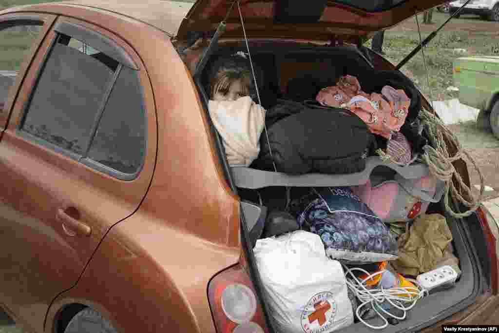 A refugee looks out from a car on the road to Armenia. Many refugees have been stuck on the road, some without enough food and water. Azerbaijan opened the road on September 24, four days after a cease-fire agreement that ended the lightning military operation.&nbsp;