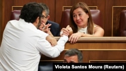 Francina Armengol, of Spanish Socialist Workers' Party (PSOE), is greeted following her election as speaker during a parliament session