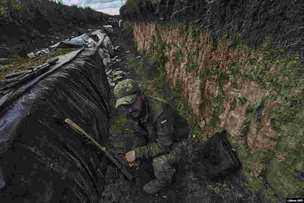 A Ukrainian soldier sits in a trench at the front line near Bakhmut on May 22. Two days earlier, the chief of Russia&#39;s Wagner mercenary group, Yevgeny Prigozhin, claimed his troops had taken control of the city.