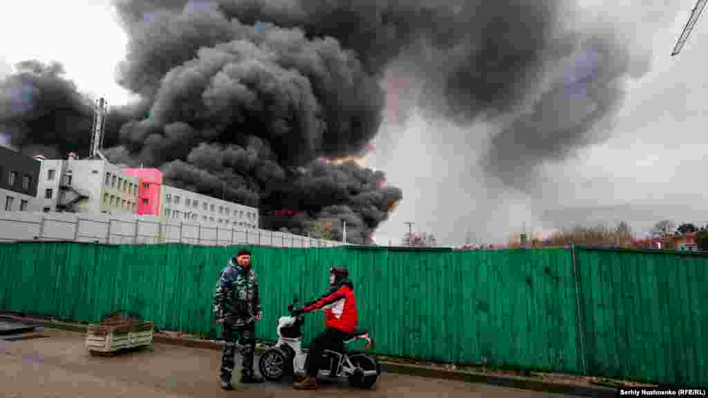 A fire in a storage facility outside Kyiv caused by Russian shelling on March 3, 2022.