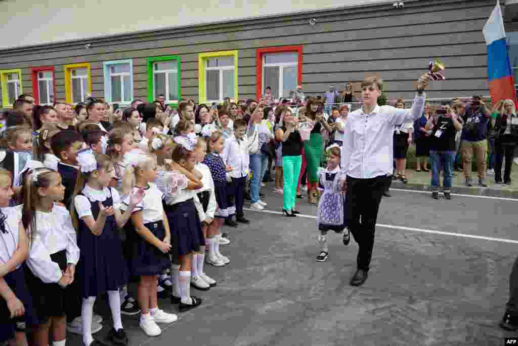 Schoolchildren take part in a &quot;first bell&quot; ceremony to mark the beginning of the new school year at a newly opened school in Mariupol on September 1. The Russian Defense Ministry has completed the construction of a new comprehensive school in Mariupol for 1,100 students, its press service said. In May 2022, the Ukrainian port of Mariupol fell to Russian forces after weeks of fighting that left the city almost completely devastated.