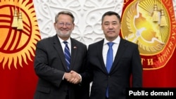Kyrgyz President Sadyr Japarov (right) and U.S. Senator Gary Peters, the chair of the Homeland Security and Governmental Affairs Committee