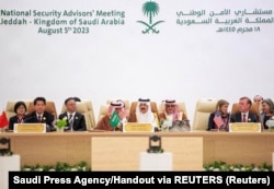 Зустріч політичних та безпекових радників в саудівській Джидді в серпні 2023 року. То була єдина з чотирьох зустрічей радників, в якій взяв участь представник Китаю (Лі Хуей)