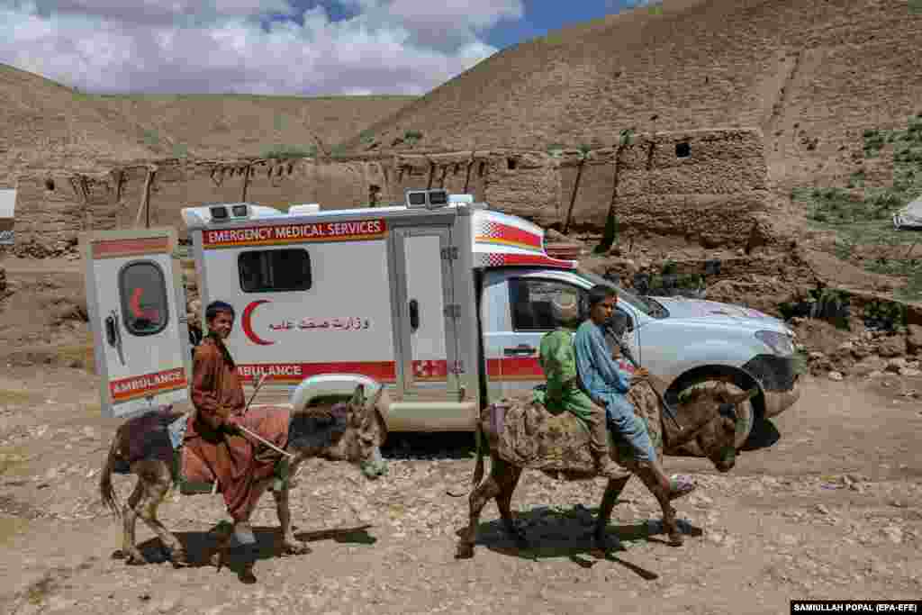 An ambulance reaches flooded areas near the village of Shirjalal in Baghlan. The destruction was most severe in Baghlan Province, where &quot;unprecedented rainfall&quot; has damaged or destroyed thousands of homes since May 10.