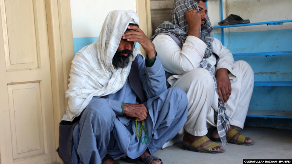 Relatives attend the funeral of an Afghan man who was killed in the suicide attack in Kandahar on March 21.