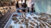 Pripremanje tradicionalnih kolača koji će u okviru humanitarne inicijative na ramazanski Bajram biti podeljeni raseljenim palestinskim porodicama u gradu Rafa na jugu Pojasa Gaze, 8. april 2024.