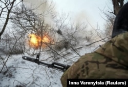 Ukrainian forces return fire near the Donetsk region town of Chasiv Yar in February.