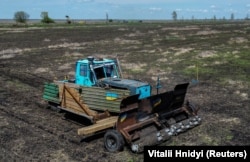 The remote controlled demining machine created by local farmer Oleksandr Kryvtsov at work in an agricultural field near the village of Hrakove, in Kharkiv