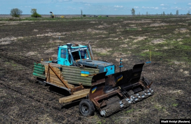 The remote controlled demining machine created by local farmer Oleksandr Kryvtsov at work in an agricultural field near the village of Hrakove, in Kharkiv
