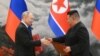 Russian President Vladimir Putin and North Korean leader Kim Jong Un shake hands in Pyongyang on June 19. 