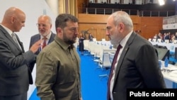 Spain - Armenian Prime Minister Nikol Pashinian talks to Ukraine's President Volodymyr Zelenskyy during a European Political Community summit in Granada, October 5, 2023.