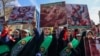 People take part in a funeral procession on April 5 for seven Islamic Revolutionary Guards Corps members killed in a strike in Syria, which Tehran has blamed on Israel. 