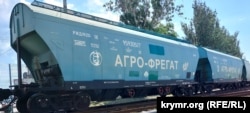 A freight car for grain in the Crimean port of Feodosia bears the name of the Russian company Agro-Fregat, in June 2023.