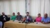 Bosnian Minister for Social Affairs Adnan Delic (center) holds a press conference at the Pazaric Institute for the Care of Mentally Disabled Children and Youth in Sarajevo on August 16. 