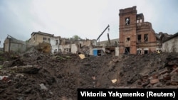 A view shows a crater left by a Russian missile strike in the city of Kupyansk, Kharkiv region, on April 25.