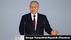 Russian President Vladimir Putin delivers his annual address to the Federal Assembly in Moscow on February 21.