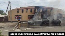 Ukrainian emergency workers fight a blaze caused by a Russian strike on the city of Lyman on July 8. 