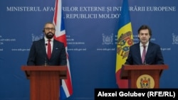 British Foreign Minister James Cleverly (left) and his Moldovan counterpart, Nicu Popescu, in Chisinau on March 16.