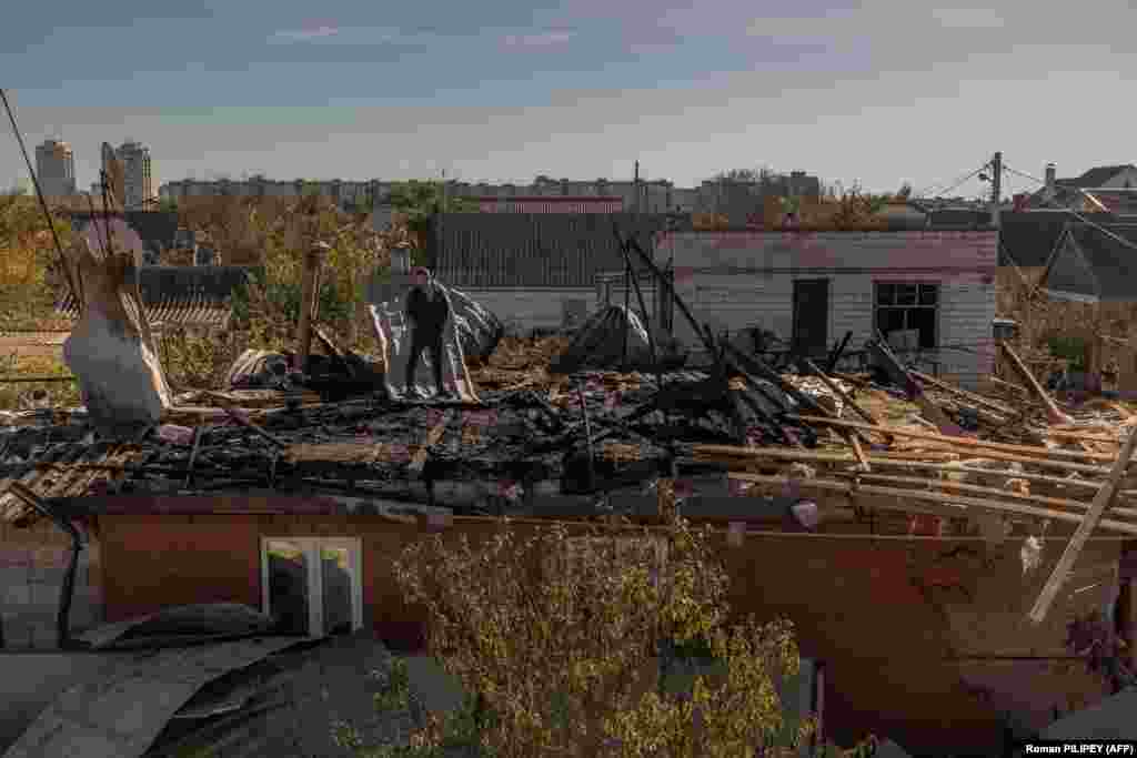 A man surveys the damage to a house from an overnight attack on October 30. On October 31, the head of the Kherson Regional Military Administration, Oleksandr Prokudin,&nbsp;reported on social media: &quot;Over the past day, the enemy fired 98 times at the Kherson region, firing 447 shells from mortars, artillery, Grad, tanks, UAVs, and aircraft.&quot;&nbsp;