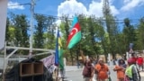 Protesters in Noumea, New Caledonia, wave an Azerbaijani flag.<br />
<br />
This January 2024 image is one of several showing flags and symbols of the distant Caucasus country being wielded by indigenous Kanak people ahead of the mass unrest that is currently roiling New Caledonia.&nbsp;<br />
<br />
<br />
&nbsp;