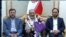 اسدالله اسدی (وسط)، محکوم به اقدام تروریستی پس از ورود به تهران در میان استقبال دو مقام جمهوری اسلامی