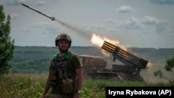 A Ukrainian MSLR BM-21 Grad fires toward Russian positions near Bakhmut at the front line in Donetsk region, Ukraine, on June 21.
