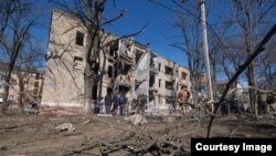 People visit the site of a Russian missile strike on a residential building in Kramatorsk on March 14. 