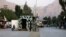 Taliban security personnel stand guard near the closed gates of the Torkham border crossing between Afghanistan and Pakistan in Afghanistan's eastern Nangarhar Province on September 6.