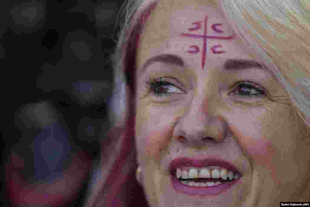 A woman wearing four Cyrillic letters for &quot;S&quot; on the Serbian cross, meaning, &#39;&#39;Only unity saves the Serb,&#39;&#39; demonstrates during a protest in Sabac, Serbia.&nbsp;Thousands of people rallied in several towns in Serbia to protest a lithium excavation project that the Balkan country&#39;s government recently signed with the European Union.