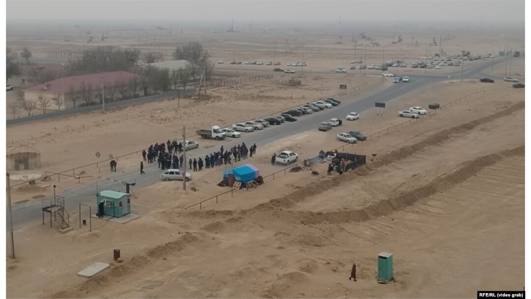 Zhetybai protesters block a road.