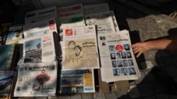 A kiosk in Tehran in October 2022, displays copies of newspapers featuring a report on the detention by authorities of two journalists, who reportedly helped publicize the case of Masha Amini. Iran has long sought to control the flow of information in the country.