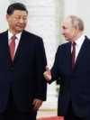 Президент России Владимир Путин с президентом Китая Си Цзиньпином во время официальной церемонии встречи в Большом Кремлевском дворце в Москве, 21 марта 2023 года.