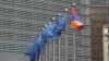 Belgium - EU and Armenian flags fly outside the EU headquarters in Brussels.