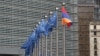 Belgium - European Union and Armenian flags fly outside the EU headquarters in Brussels.