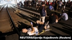 People block the Centre Railway Station in Belgrade during a protest against Rio Tinto's lithium mining project. 