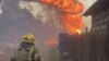 Под Красноярском горят и взрываются частные дома