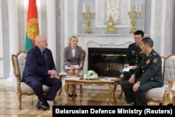Belarusian authoritarian leader Alyaksandr Lukashenka (left) and Chinese Defense Minister Li Shangfu (right) in Minsk on August 17.
